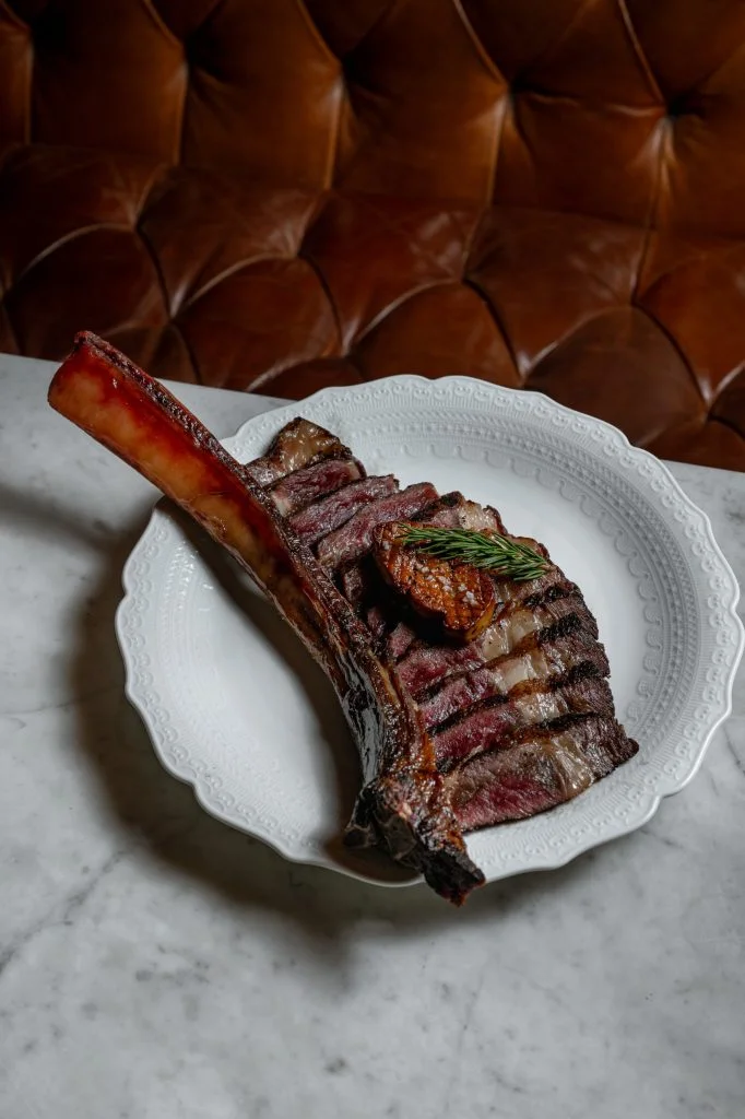 Côte de Bœuf Wagyu, a sliced Tomahawk Ribeye Steak with pan-seared foie gras, at dinner at Gooseberry French Restaurant, Bingin, Uluwatu