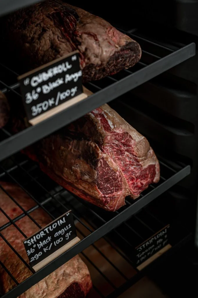 Dry-aged Black Angus cube roll and short loin on the aging shelves at Gooseberry, Bingin, Uluwatu